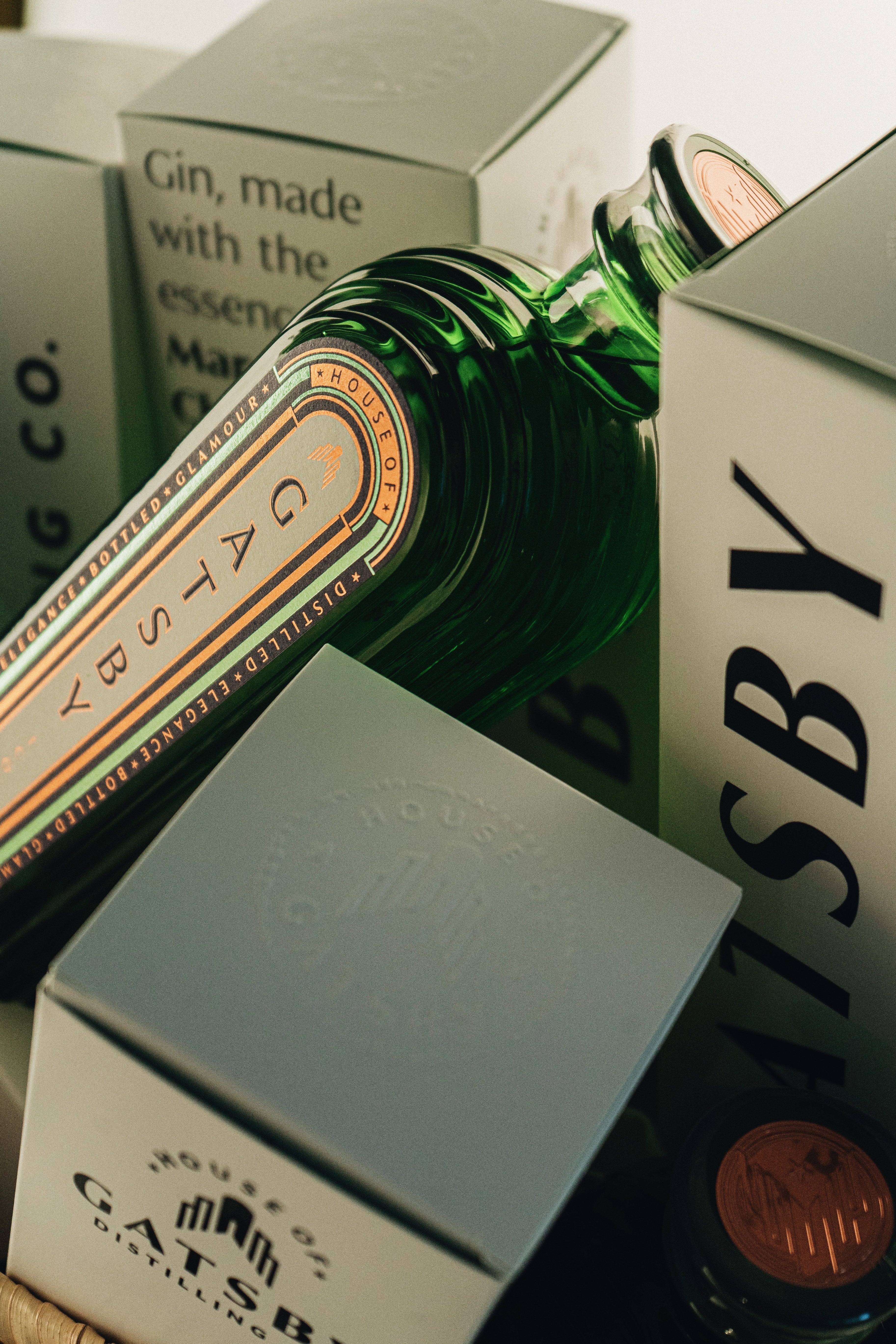 Gatsby Gin bottle emerging from its gift box, close-up
